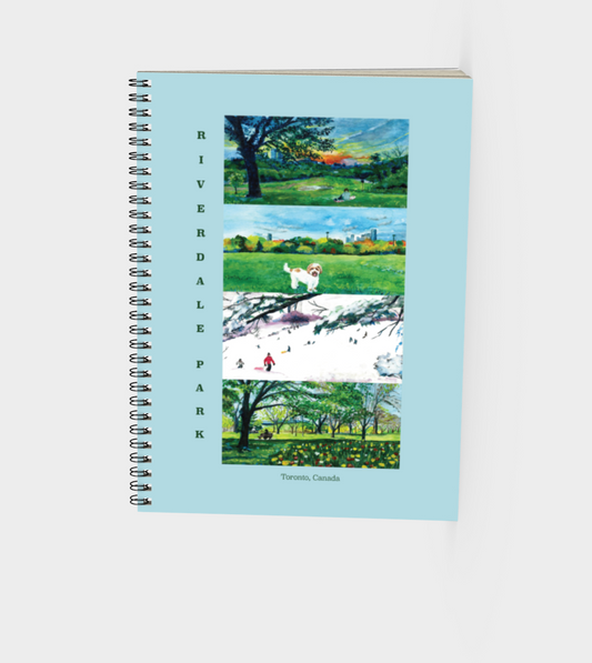 Spiral notebook featuring a painting and blue background on the cover